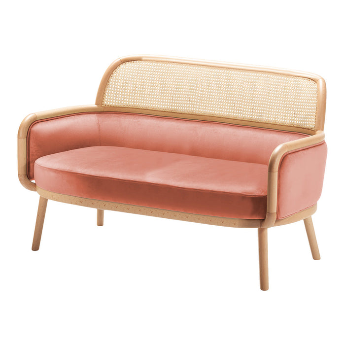 Pink velvet and natural rattan two-seat sofa, featuring a smooth, streamlined design and wooden legs.