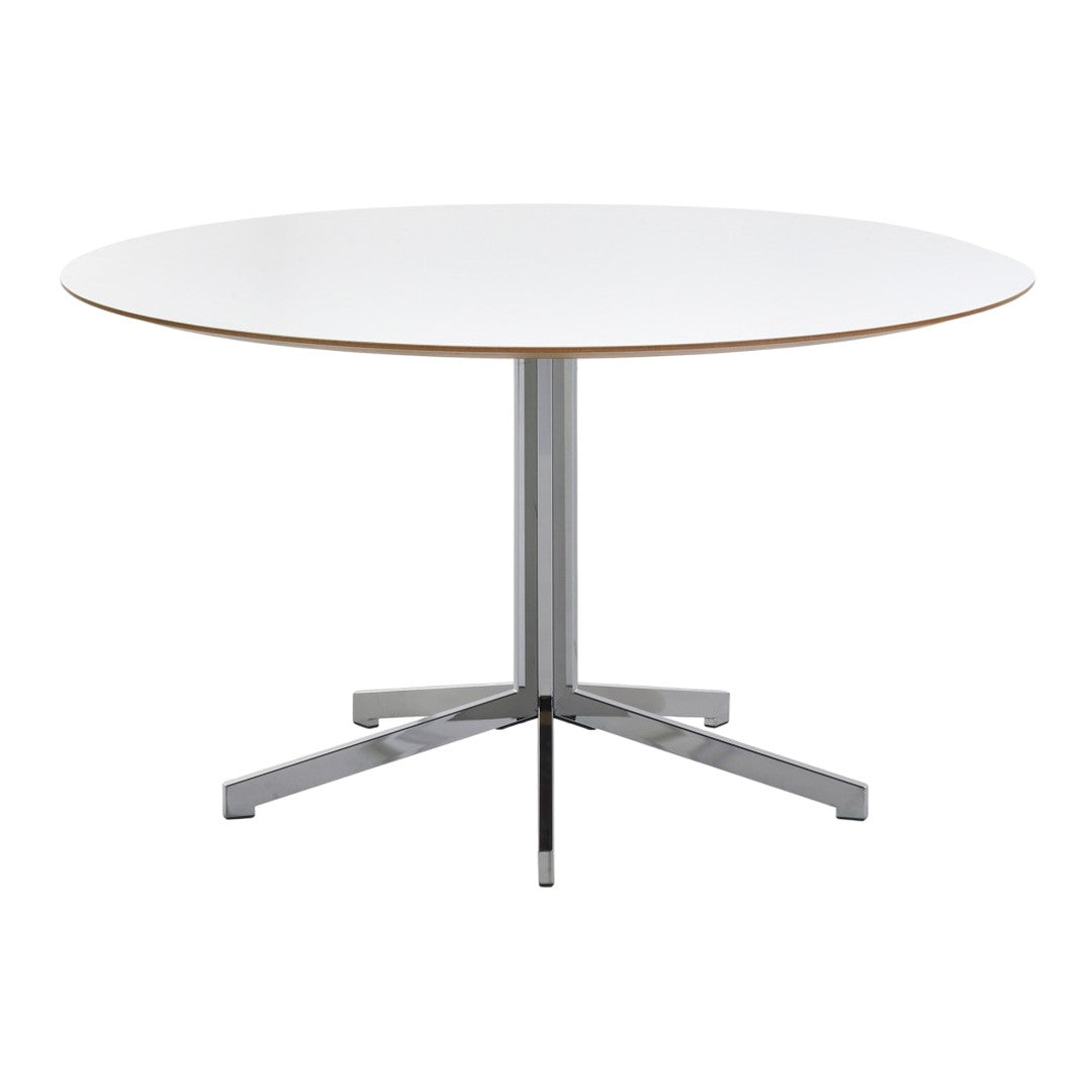 Round white table with a smooth surface and chrome base, featuring minimalist design and sleek lines.