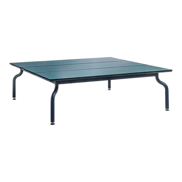 Square outdoor table with a sleek blue surface and sturdy dark blue legs, featuring simple, modern lines.