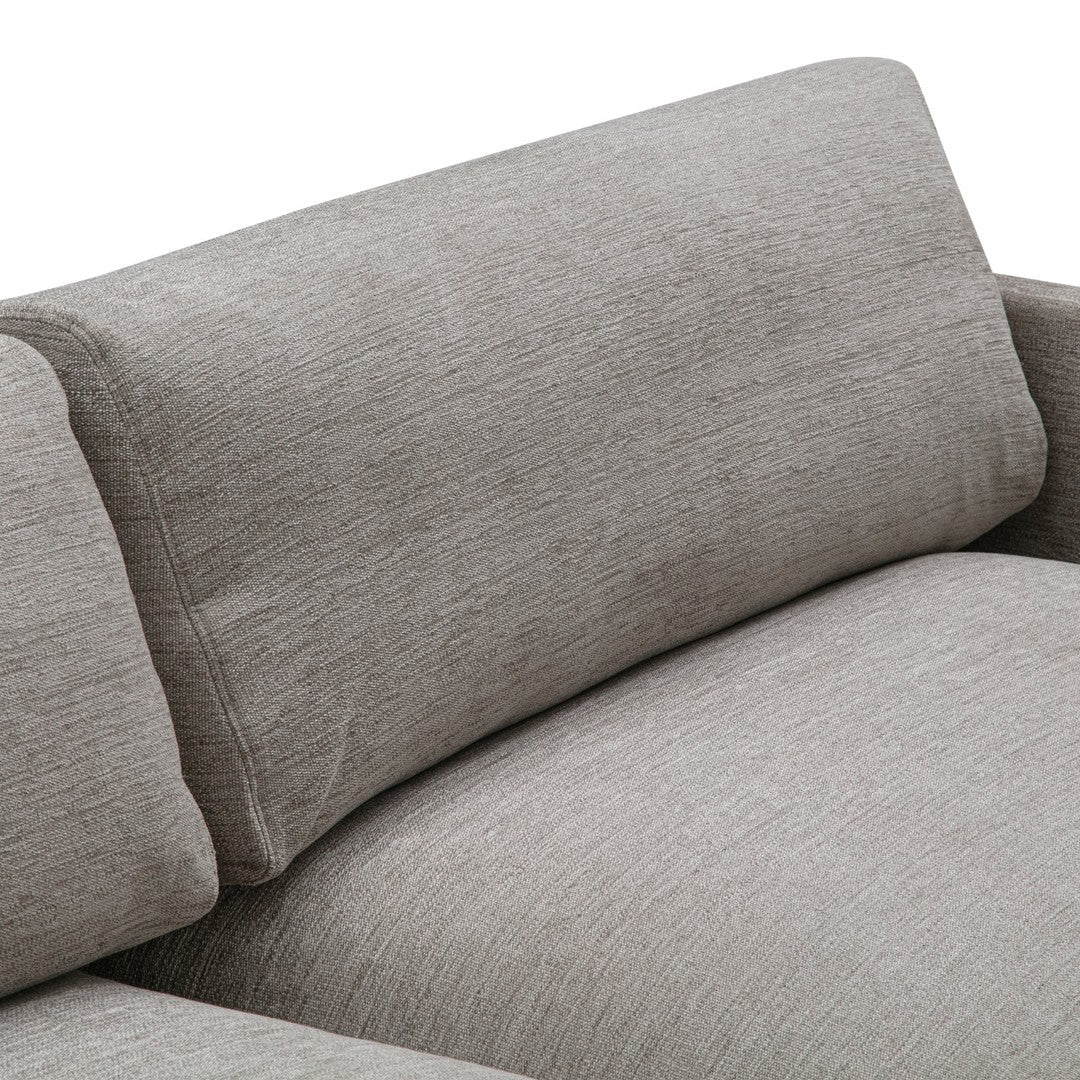 Light gray textured fabric with subtle variations, adding depth and sophistication to modern decor.