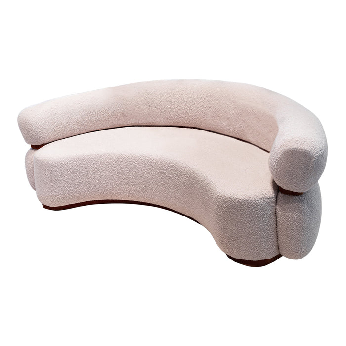 Curved sofa in soft beige upholstery, featuring a smooth, minimalist design with rounded edges and no patterns.