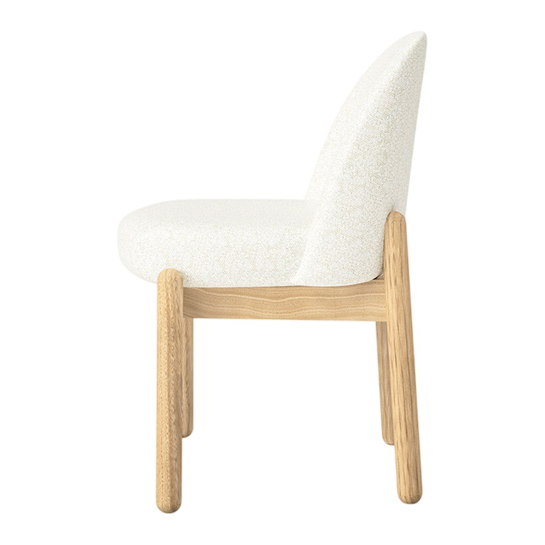 "Modern side chair in soft white upholstery with a natural wood frame, showcasing a minimalist design."