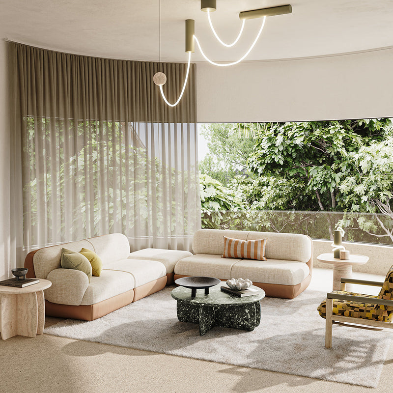 Modern living room featuring beige, green, and earthy tones with striped and textured patterns on furniture and decor.