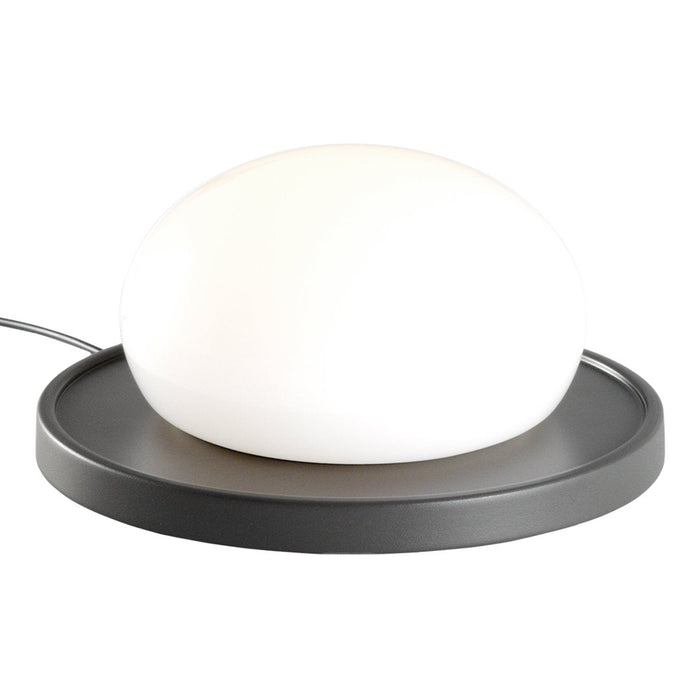 White spherical lamp on a sleek black circular base, minimalist design with a smooth finish. Perfect for modern decor.
