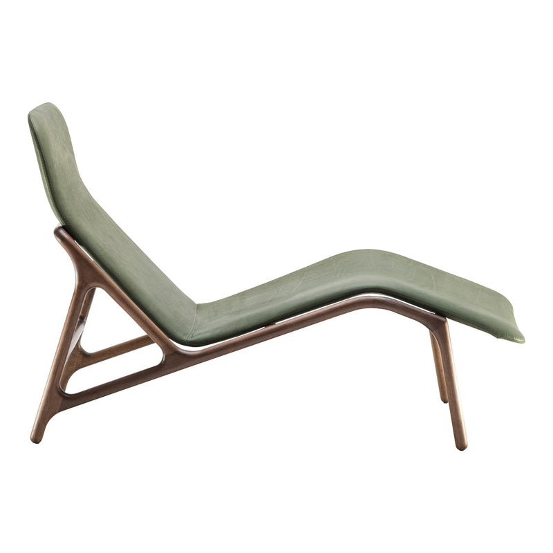 Green upholstered chaise lounge with a sleek wooden frame, showcasing minimalistic design and soft curves.