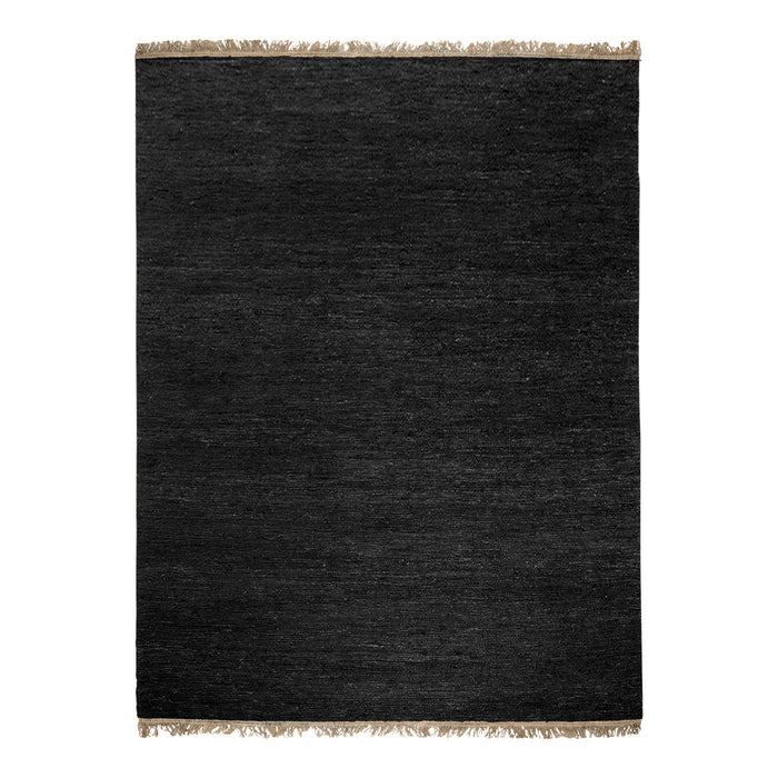 Black textured rug with fringed edges, offering a sleek and modern look for any decor.