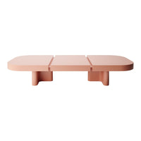 Pink minimalist coffee table with smooth, rounded edges and a sleek design. Perfect for modern decor.