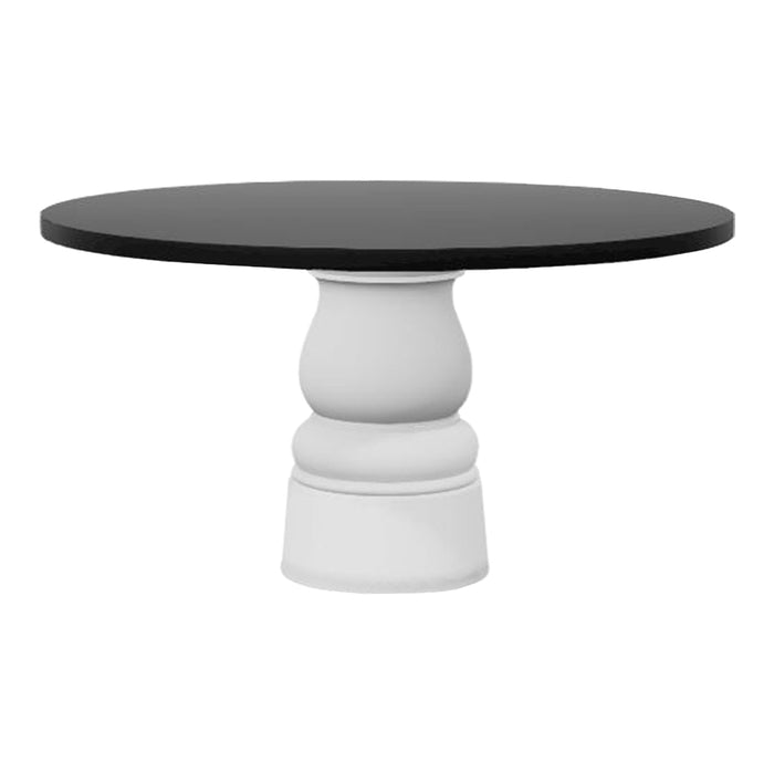 Round table with a sleek black top and a stylish white, sculpted base, perfect for modern decor.
