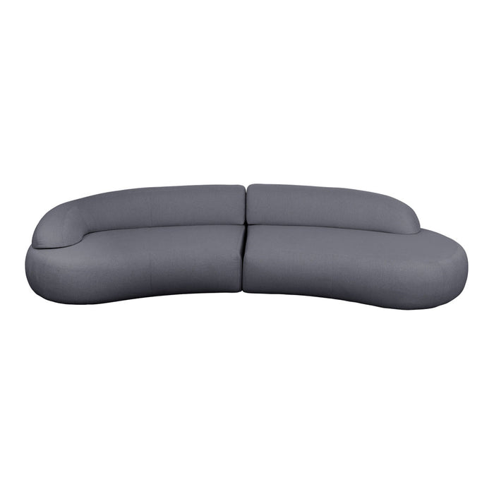 Curved gray sofa with a smooth, minimalist design, perfect for modern living spaces.