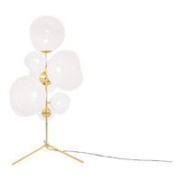 White glass globes with a sleek gold metal base, creating a modern, minimalist design. Elegant and contemporary aesthetic.