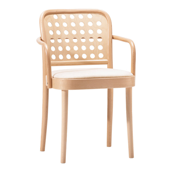 Light beige chair with a polka dot perforated backrest and a white cushioned seat, perfect for modern decor.