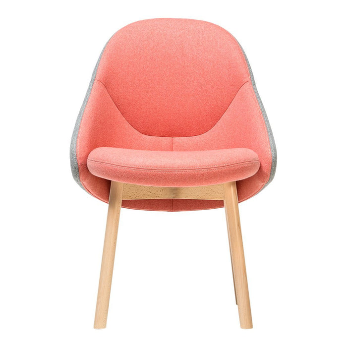 Coral pink upholstered chair with a smooth texture and light wooden legs, featuring a modern, minimalist design.