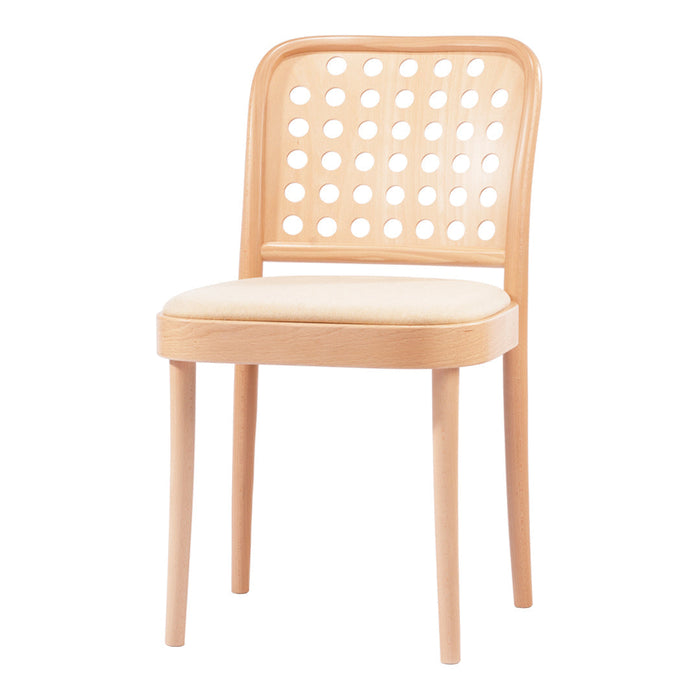 Light wood chair with a perforated backrest and soft cream cushion. Modern design perfect for minimalist interiors.