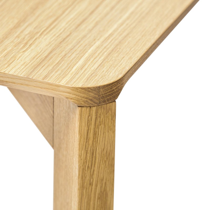 Light oak wood tabletop with natural grain pattern, featuring smooth rounded edges and matching legs.