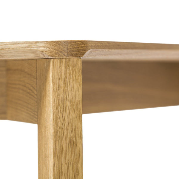 Light natural oak wood finish with subtle grain patterns and smooth edges, showcasing minimalistic design.
