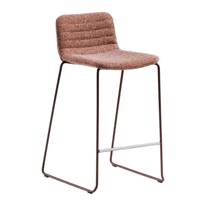 Brown textured bar stool with a ribbed seat and sleek metal legs. Modern design ideal for contemporary spaces.
