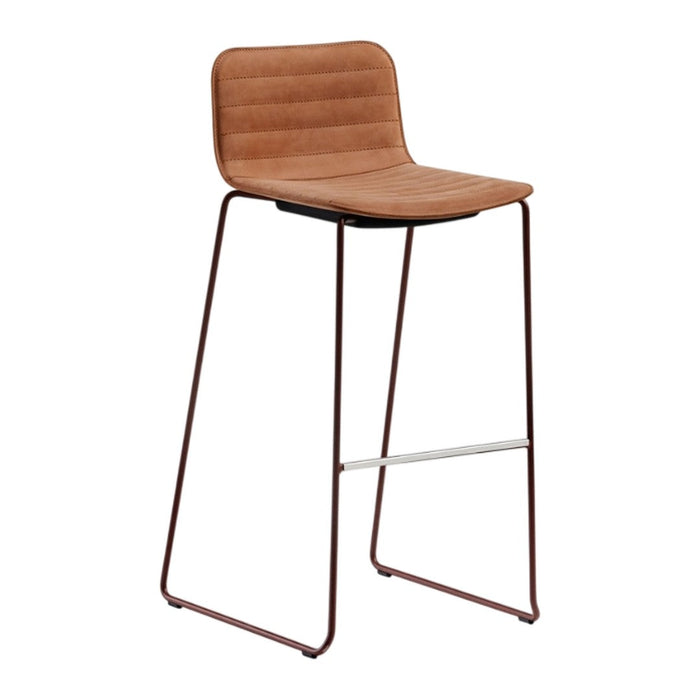 Brown padded bar stool with ribbed pattern and sleek metal frame in contrasting tones. Perfect for modern decor.