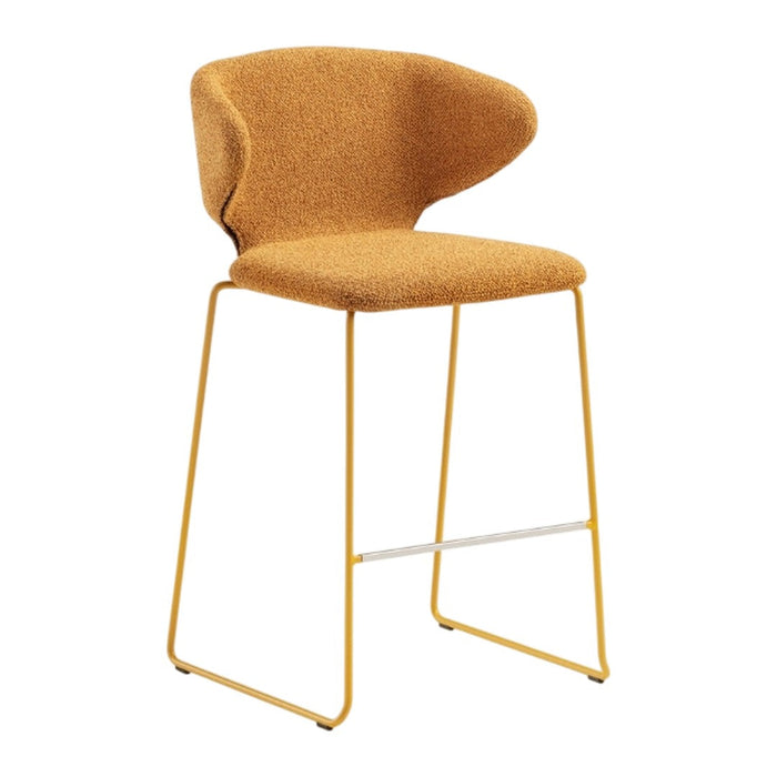 Stylish mustard yellow bar stool with a textured finish and sleek metal legs in a modern design.