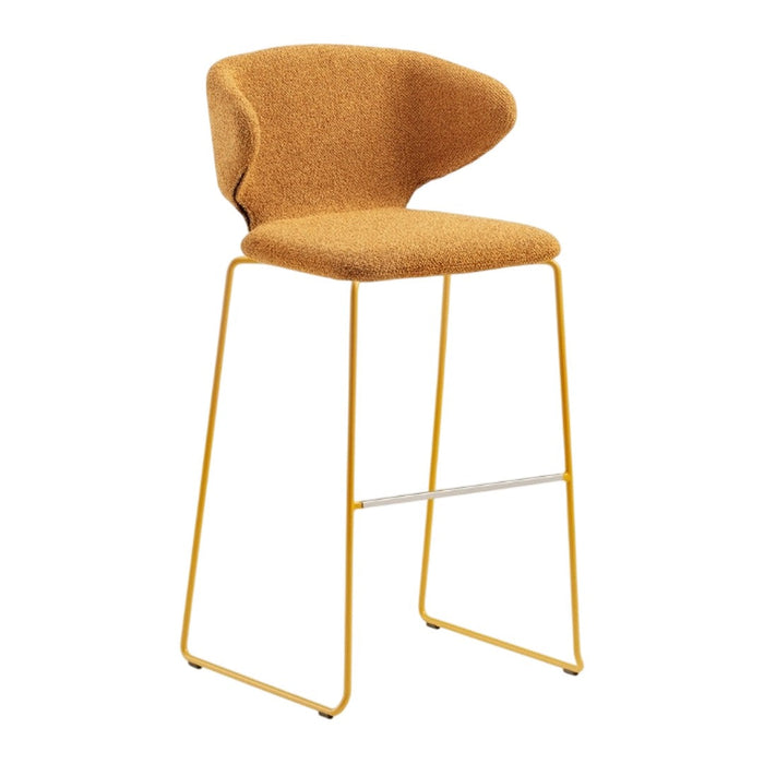 Modern bar stool with a warm mustard-yellow upholstered seat and sleek gold metal legs. Stylish and minimalist design.