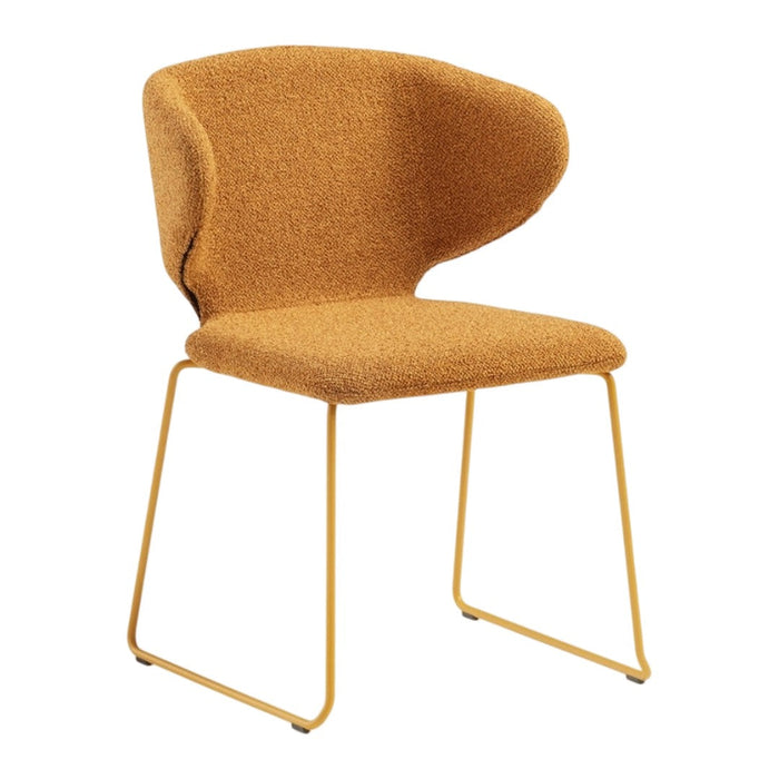 A cozy chair in warm mustard yellow fabric with a smooth, curved design and sleek gold legs. Perfect for modern decor.