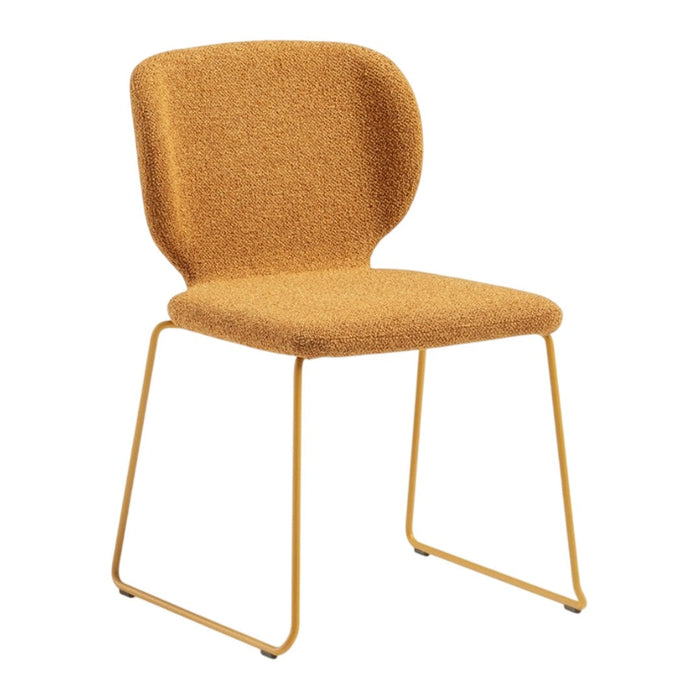 Mustard yellow textured chair with minimalist design and sleek metal legs. Perfect for modern interiors.