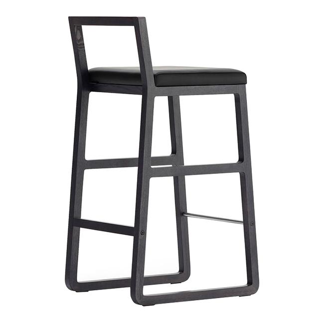 Black bar stool with a sleek, modern design featuring a simple frame and a smooth, cushioned seat.