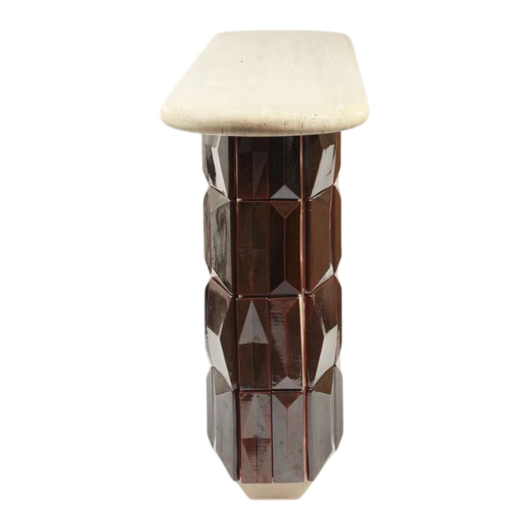 Brown faceted column base with a smooth cream top, showcasing a modern geometric design and sleek finish.