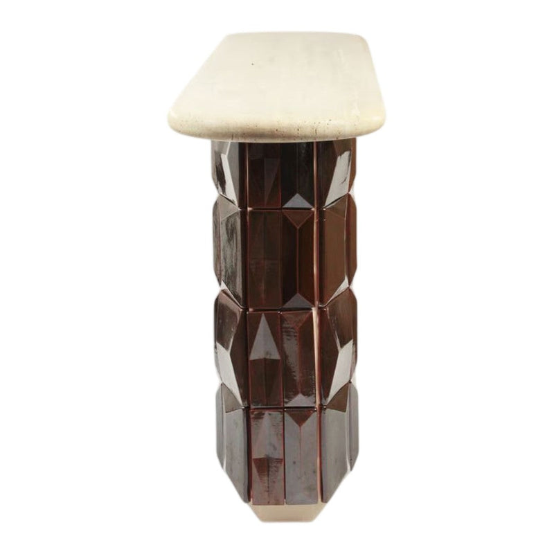 Brown faceted column base with a smooth cream top, showcasing a modern geometric design and sleek finish.