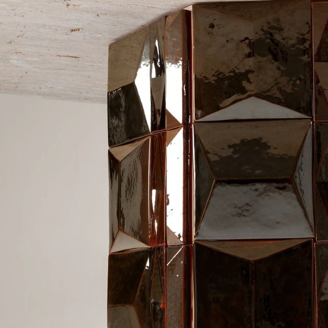 Glossy brown geometric tiles with a reflective finish, featuring sharp angles and a modern, stylish pattern.