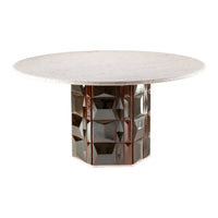Round table with a textured beige top and a reflective, geometric brown base for a modern aesthetic.