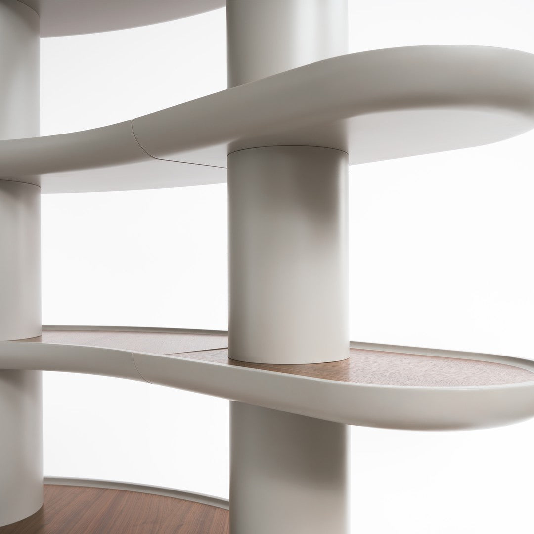 Modern shelf design with smooth white curvatures and warm wooden surfaces creating a stylish contrast.