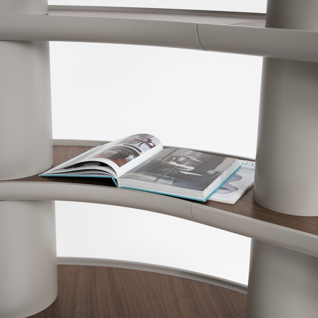 Modern bookshelf with a sleek gray finish and wood grain shelves, featuring a minimalist design.