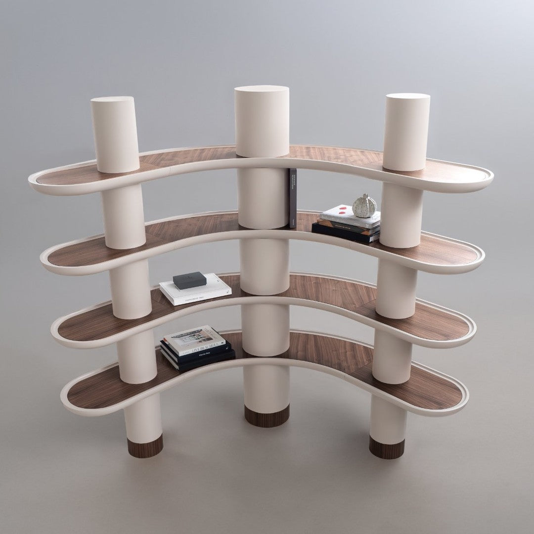 Wavy bookshelf featuring cream-colored shelves and brown wood accents, with a modern, minimalistic design.