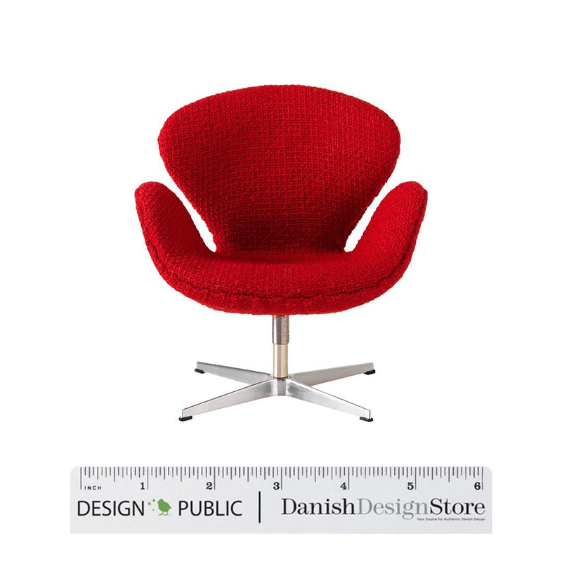 Red upholstered chair with a modern, textured pattern and sleek silver base. Perfect for adding bold color to any space.