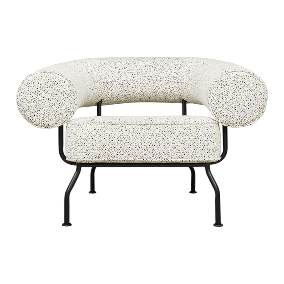 Curvy modern chair in off-white with a textured speckled pattern and black metal legs. Perfect for contemporary decor.