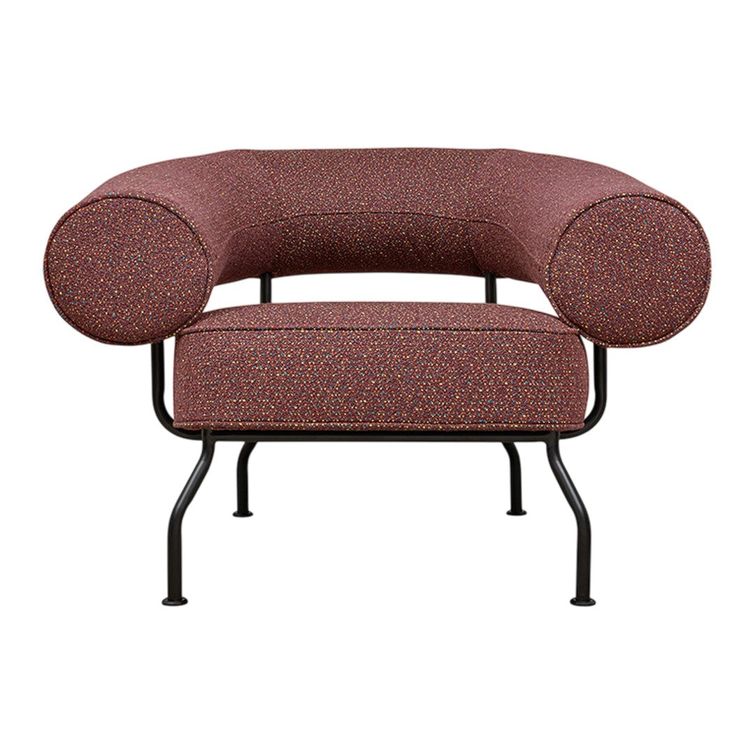 Curved burgundy chair with a textured, multi-colored dot pattern on a sleek black metal frame.