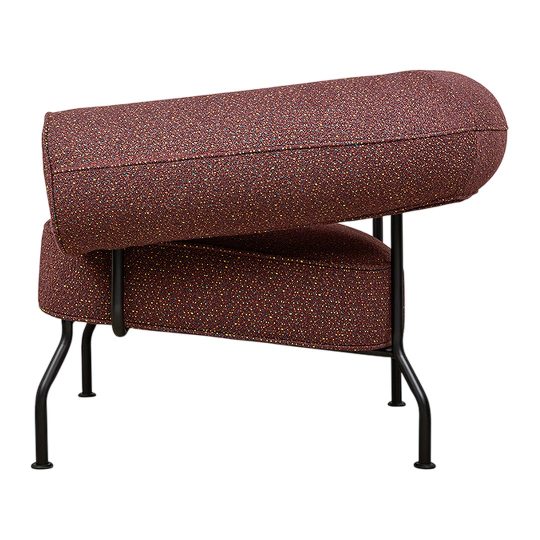 Stylish chair featuring a maroon fabric with intricate speckled patterns and a sleek black metal frame.