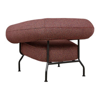 Red and blue speckled pattern on a cushioned chair with sleek black metal legs. Modern and stylish accent piece.