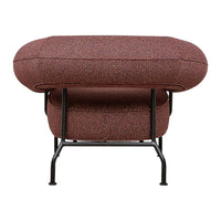 Textured burgundy pouf with colorful speckles, supported by a sleek black metal frame. Modern and vibrant design.