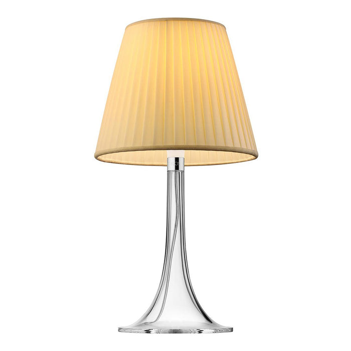 Yellow pleated lampshade on a sleek chrome base, adding a modern touch to any space. Perfect for warm lighting.