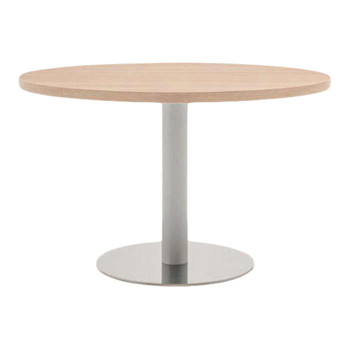 Round wooden tabletop in light beige with a sleek silver pedestal base, offering a modern and minimalist design.