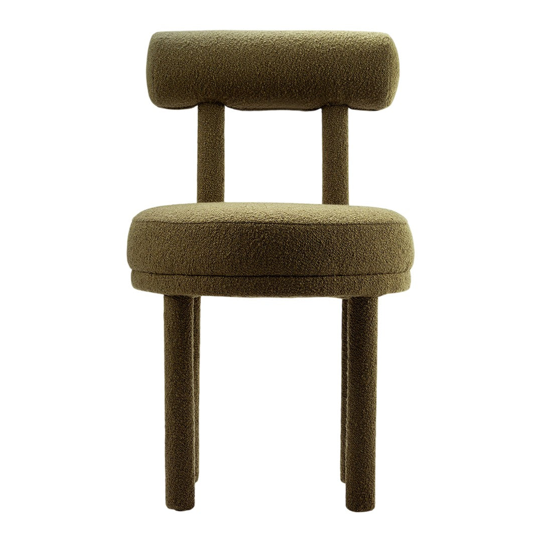 Green upholstered chair with a minimalist design and soft textured fabric. Modern and stylish accent piece for any room.
