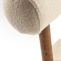 Cream textured fabric with a soft, fluffy pattern and wooden base accent. Ideal for modern home decor.