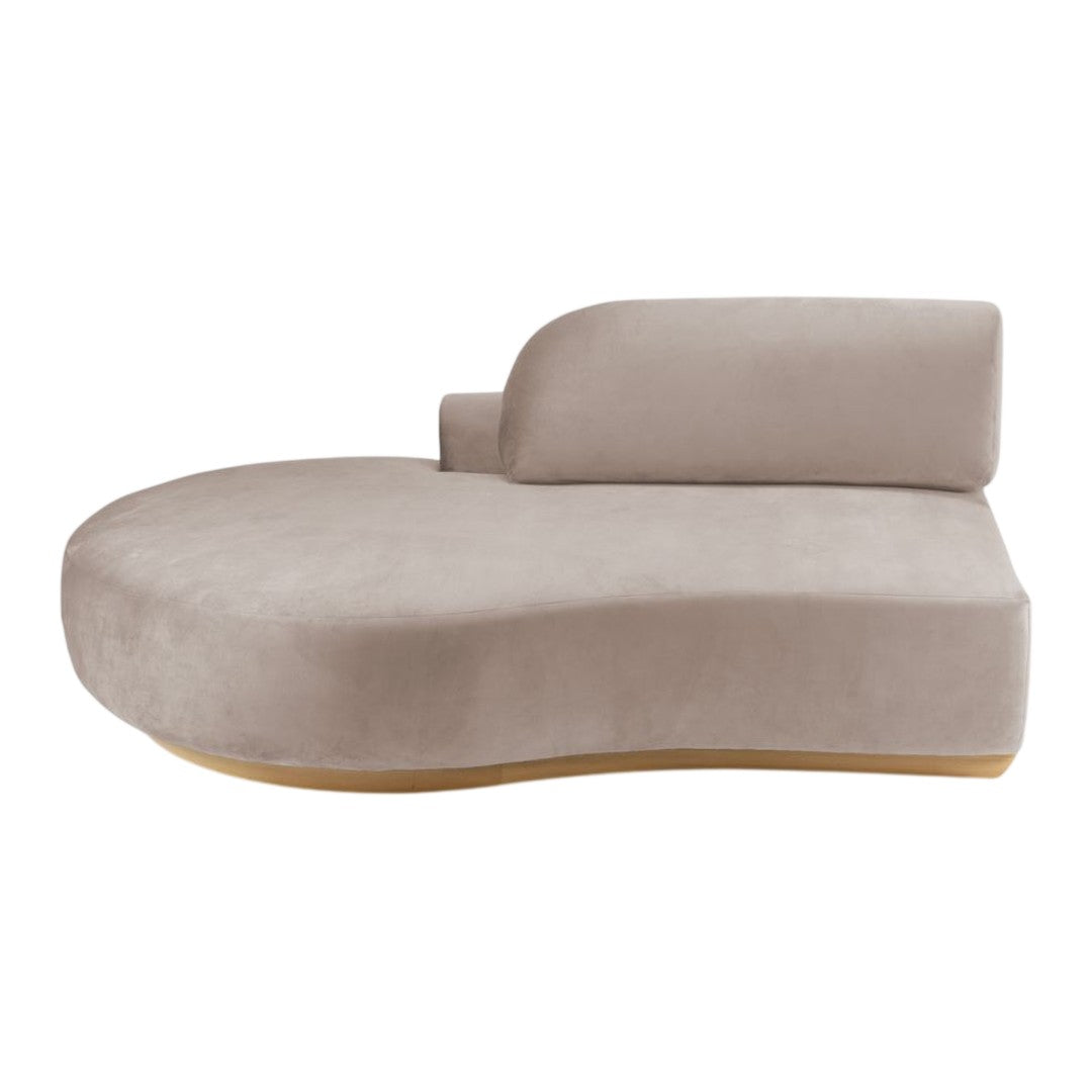 Beige curved lounge chair with a smooth texture and minimalist design, featuring a rounded backrest and wooden base.