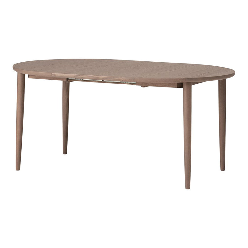 Oval wooden table in a warm brown finish with smooth surface and tapered legs, perfect for modern dining spaces.