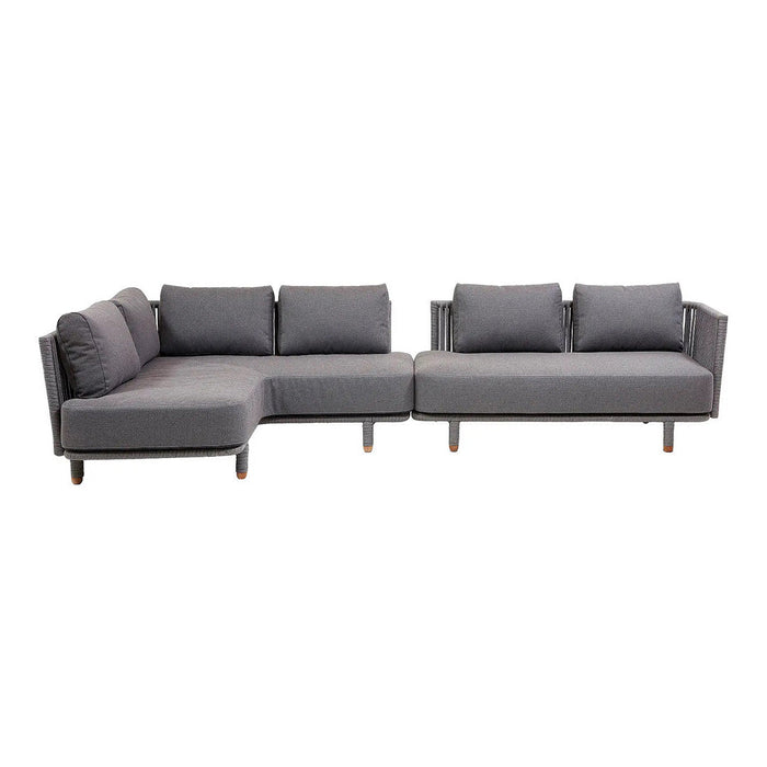 Gray sectional sofa with clean lines and modern design, featuring soft cushions and a sleek finish.