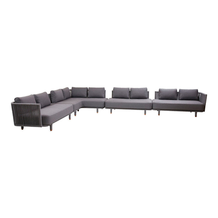 "Gray sectional sofa with a modern design, featuring clean lines and smooth fabric."