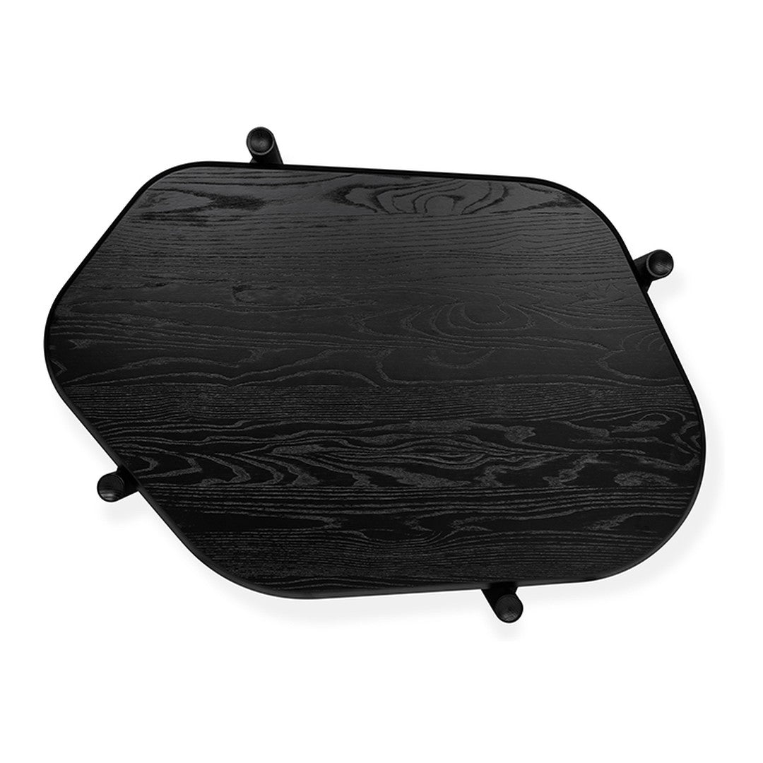 Black wooden tabletop with a unique geometric shape and smooth, matte finish. Ideal for modern decor.
