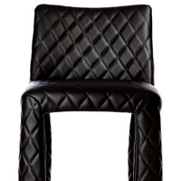 Black quilted barstool with a stylish diamond pattern for a modern touch. Perfect for contemporary interiors.