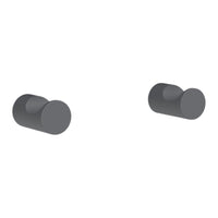 Two sleek, matte black knobs with a minimalistic round design, perfect for modern decor.